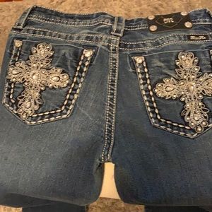 Crystal crosses & studs with silver stitching.